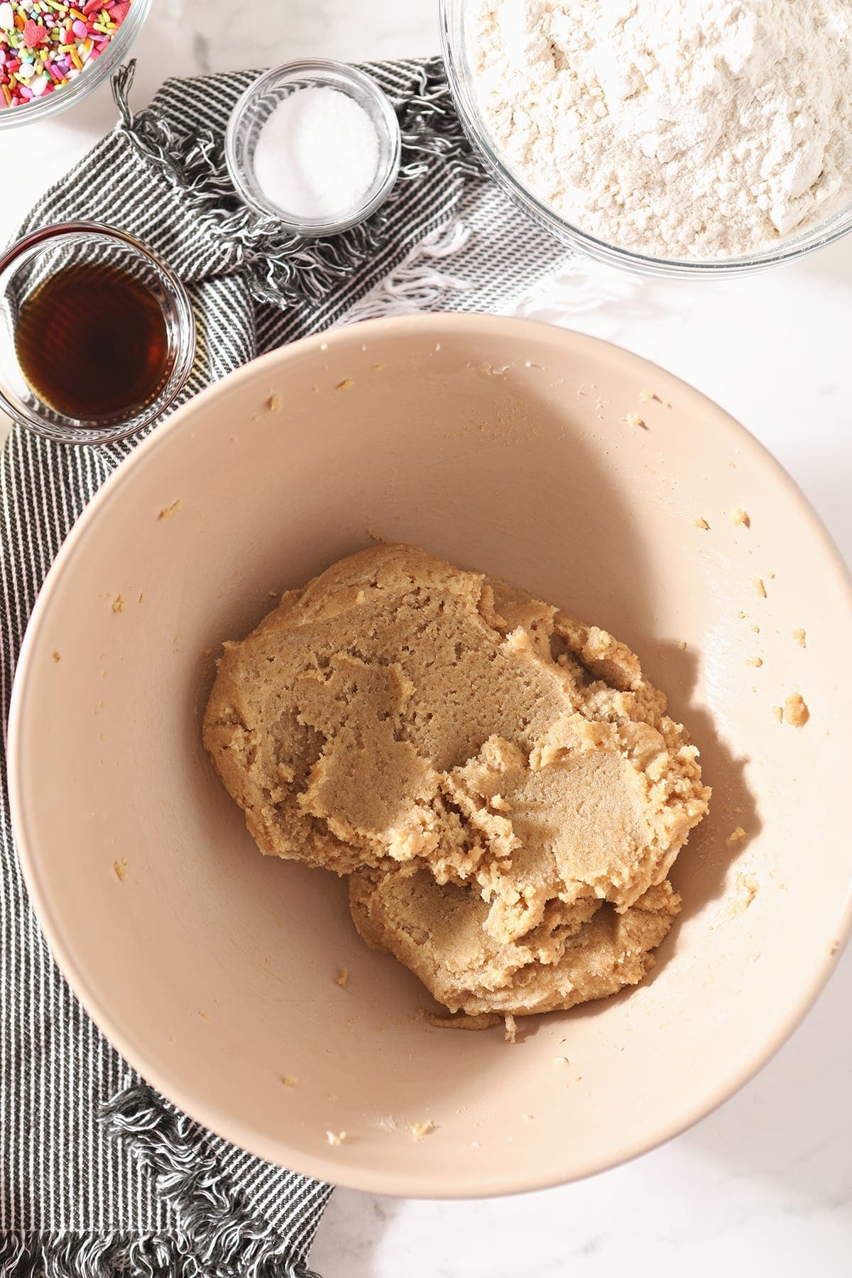 Butter and sugar mixed together in a bowl from above