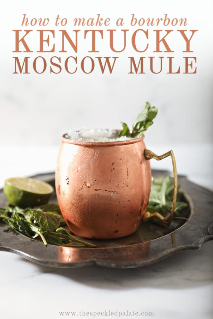 A copper mug holds a Kentucky Mule, with Pinterest text