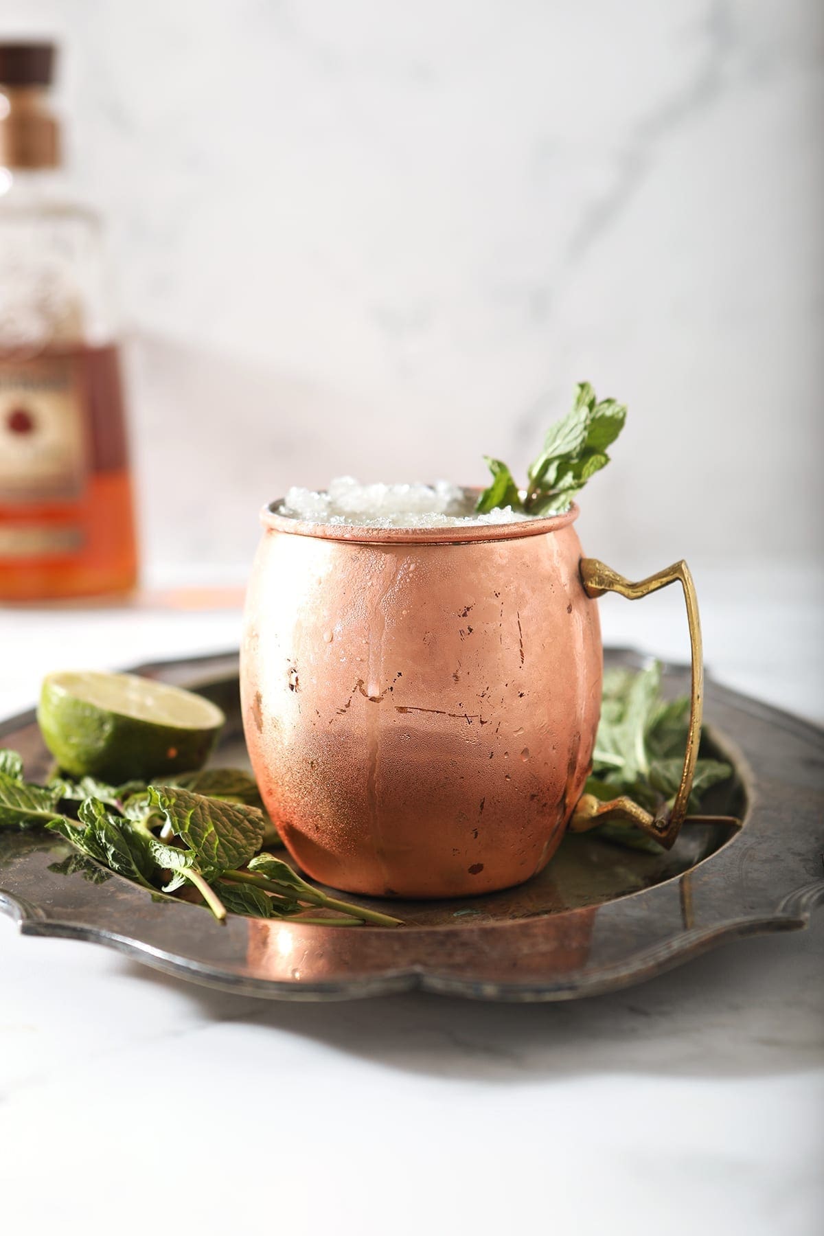 A copper mug holds a Kentucky Mule