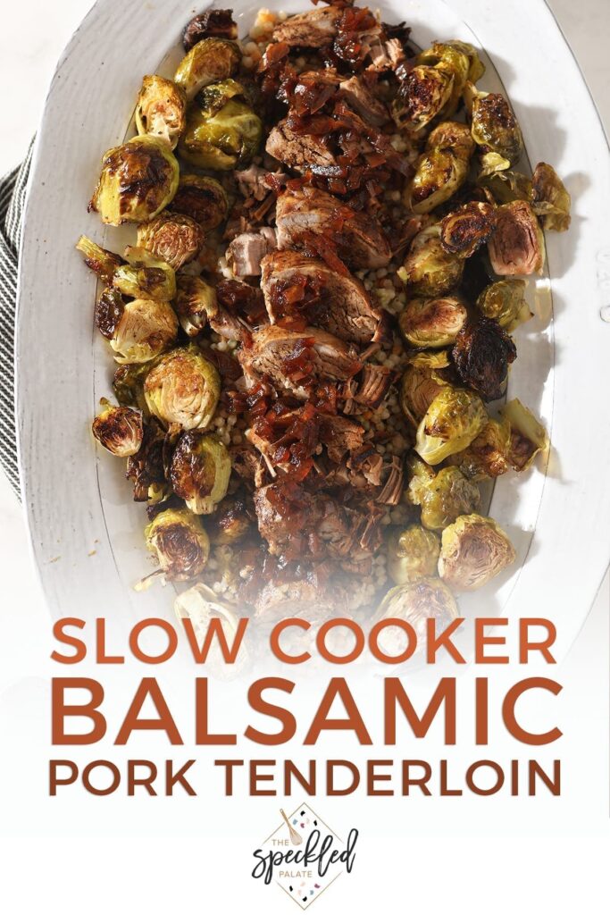 Sliced pork tenderloin and brussels sprouts on a large white platter, with text that says 'Slow Cooker Balsamic Pork Tenderloin'