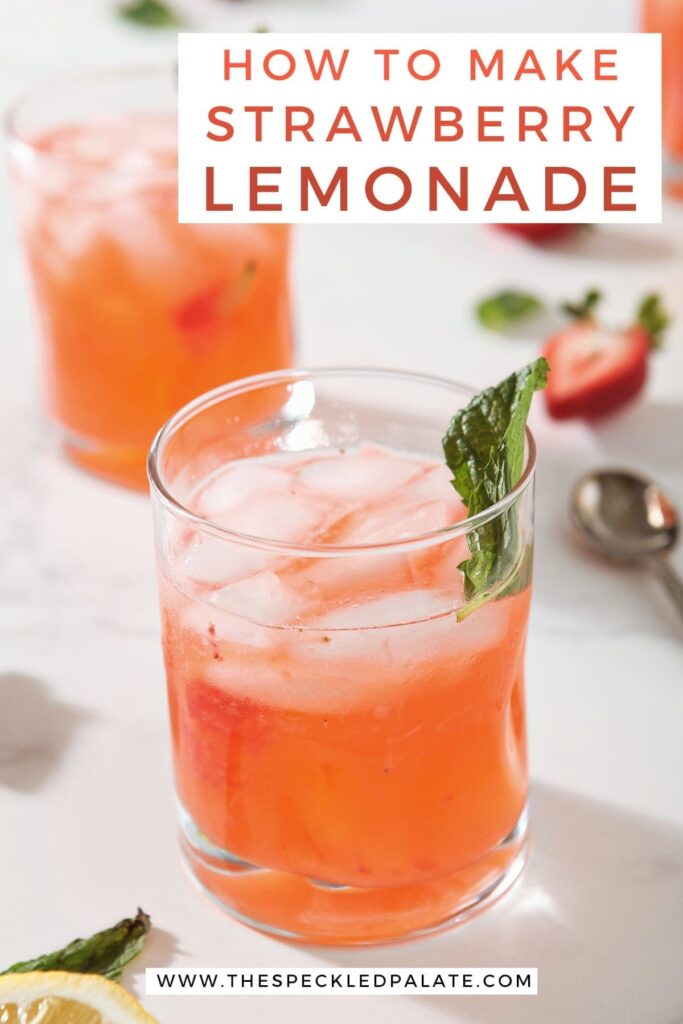 A close up of a glass of strawberry lemonade, from above