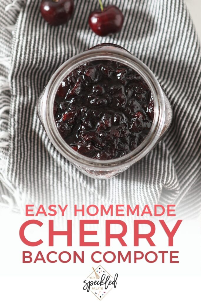 A jar of Bacon Cherry Compote from above on a grey and white striped towel with text "easy homemade cherry bacon compote"