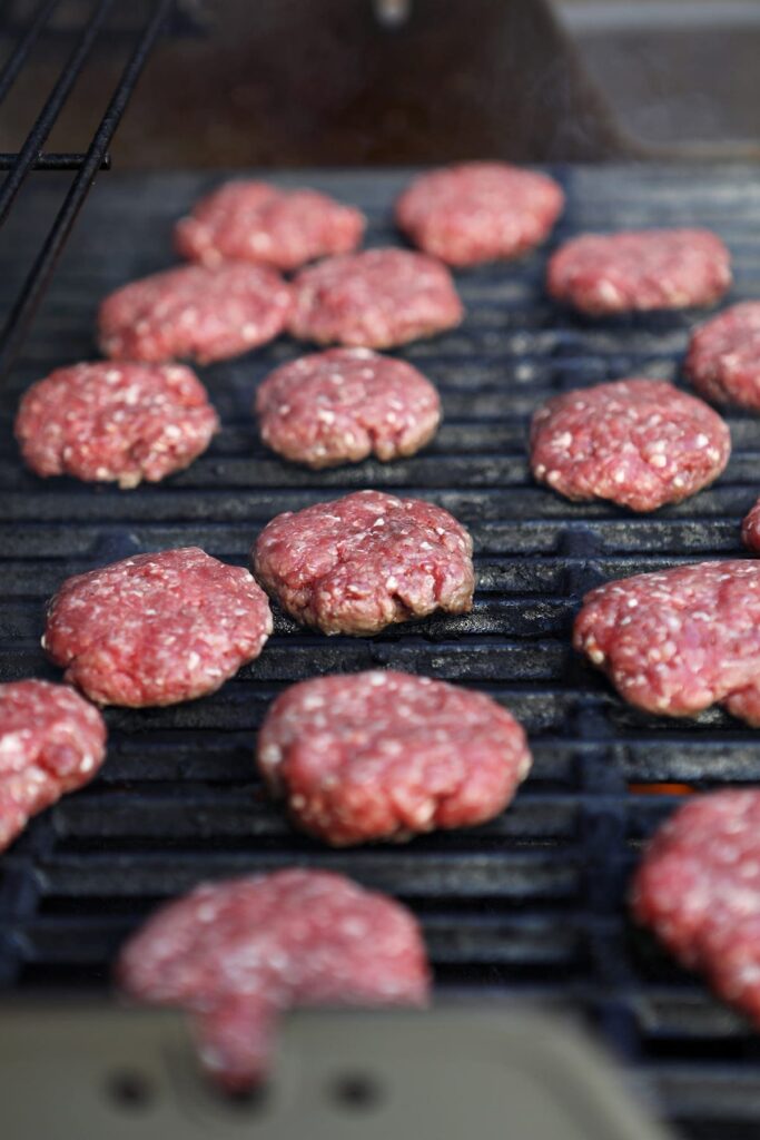 hamburger sliders on a grill