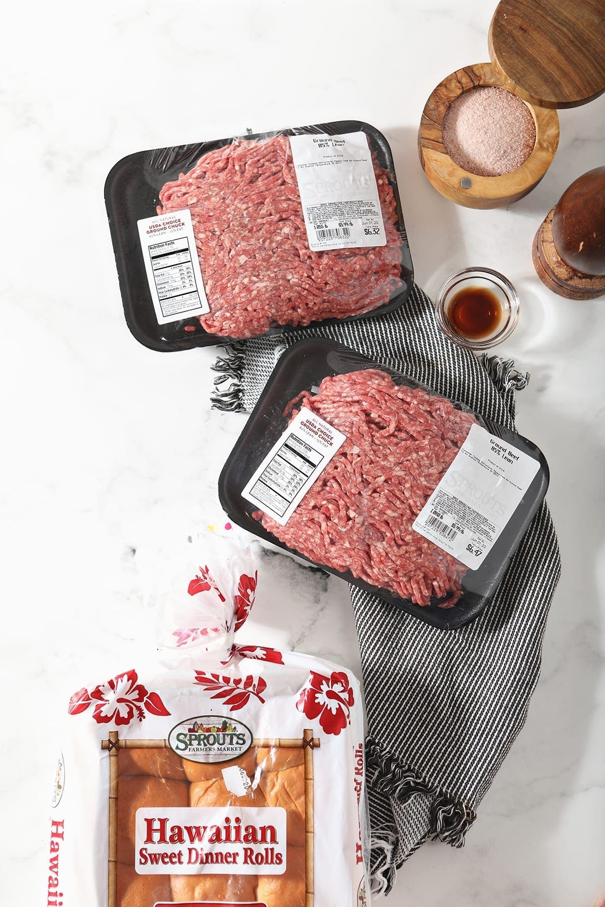 Ingredients for Hamburger Sliders from above on a marble surface