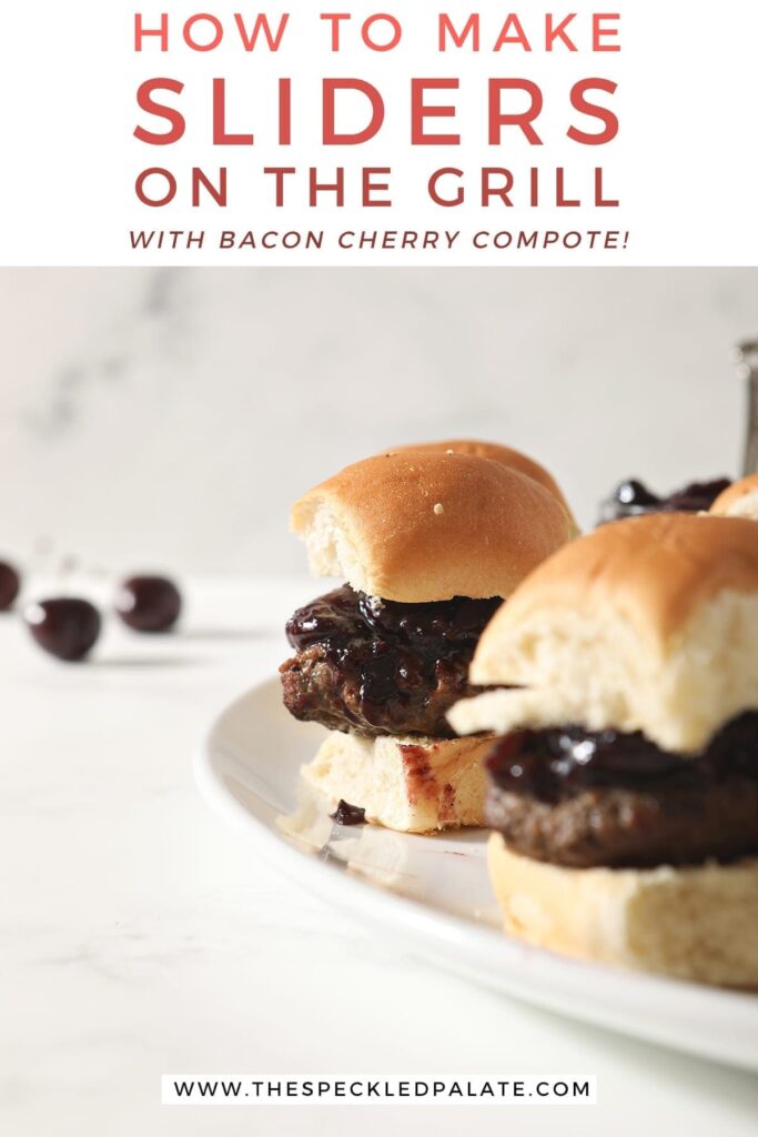 Hamburger sliders with Bacon Cherry Compote sit on a white platter before serving with text "how to make sliders on the grill with bacon cherry compote"