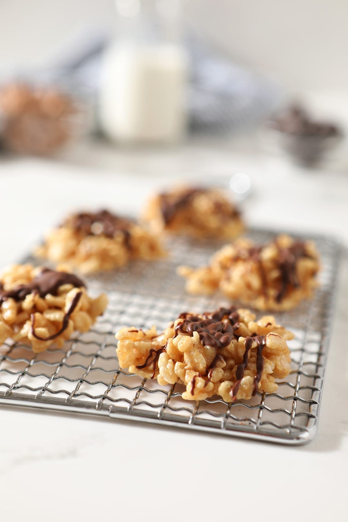 Chocolate Peanut Butter No Bake Cookies sit on a silver grate on a marble surface before eating