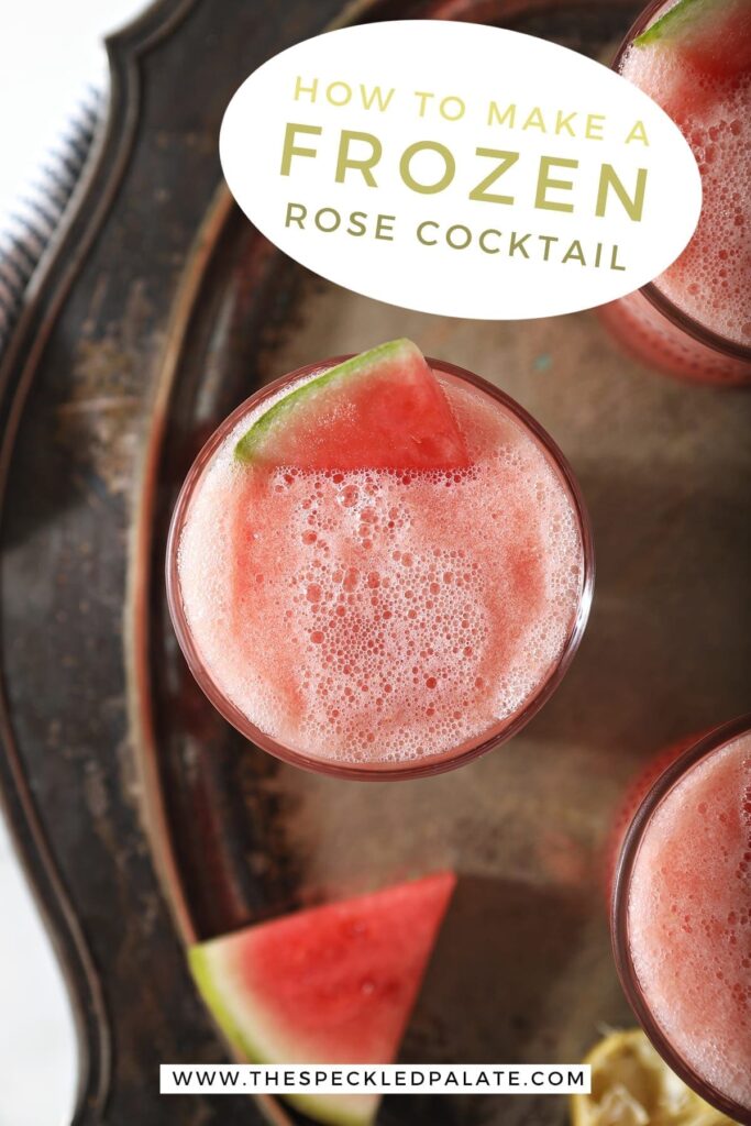 Overhead of a slushy pink drink inside three glasses, garnished with watermelon, on a silver platter, with text stating, "How to make frozen rose cocktail"