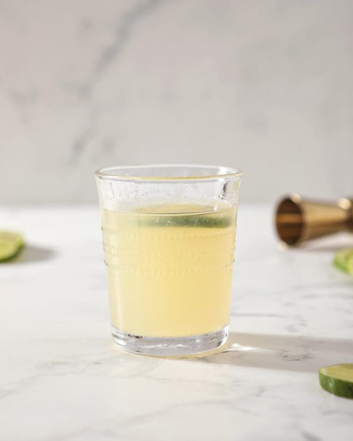A glass of a Frozen Mule sits on a marble counter