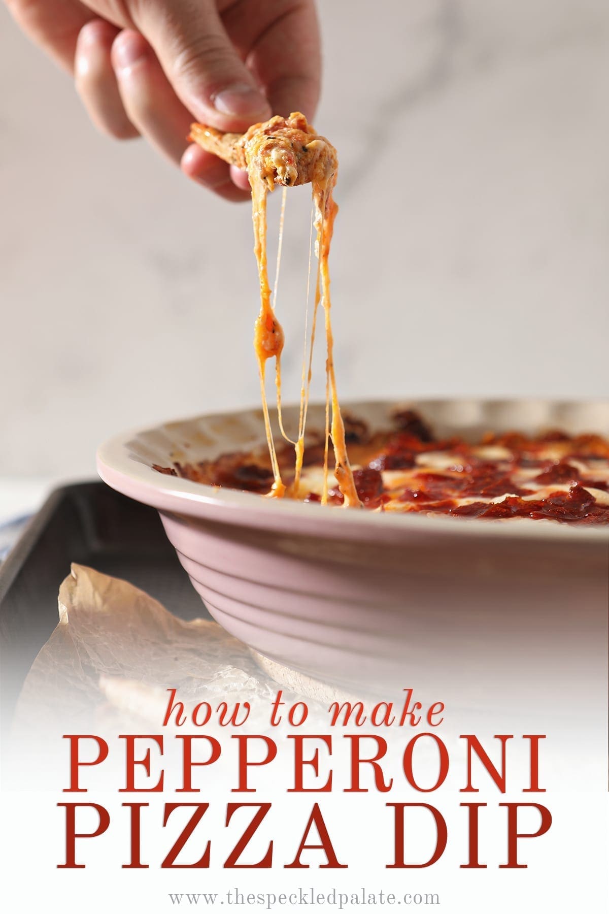 A breadstick lifts cheesy Pepperoni Dip out of a pie plate with the text 'how to make pepperoni pizza dip'