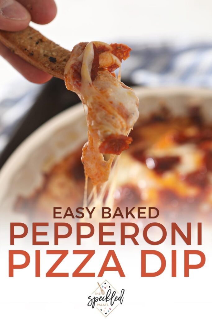 Pepperoni Dip clings to a homemade breadstick, just before eating with the text 'easy baked pepperoni pizza dip'