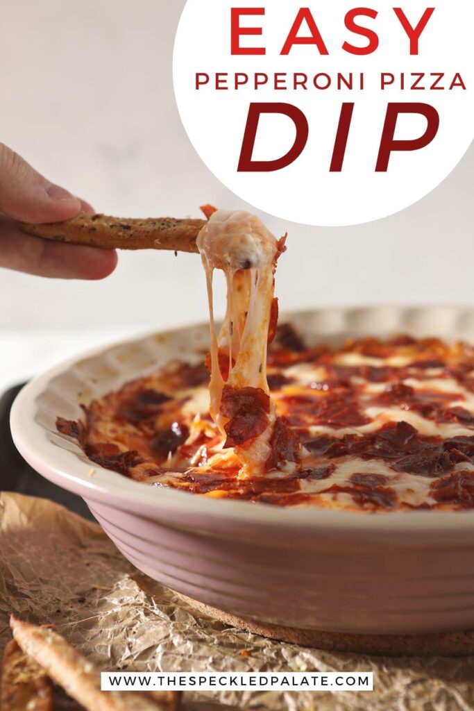 A breadstick lifts cheesy Pepperoni Dip out of a pie plate with the text 'easy pepperoni pizza dip'