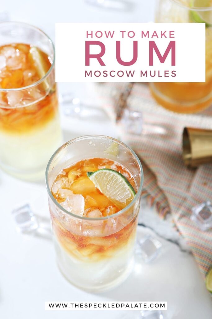 Three Rum Moscow Mules garnished with lime on marble with ice, lime wedges and a gold jigger with the text 'how to make rum moscow mules'