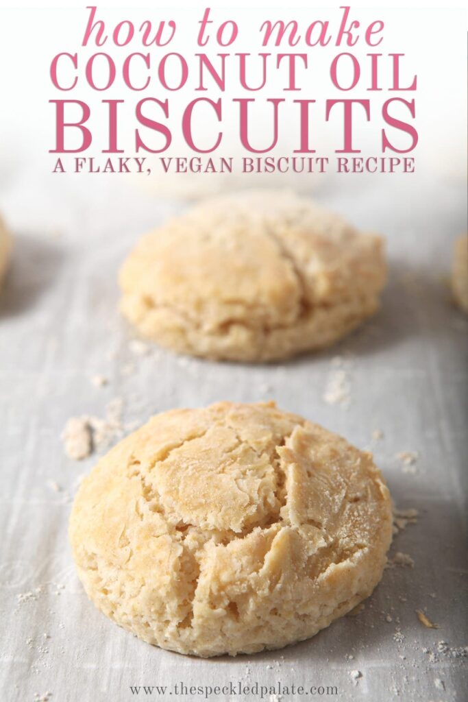 Vegan biscuits on a baking sheet after baking with the text 'how to make coconut oil biscuits. a flaky, vegan biscuit recipe'