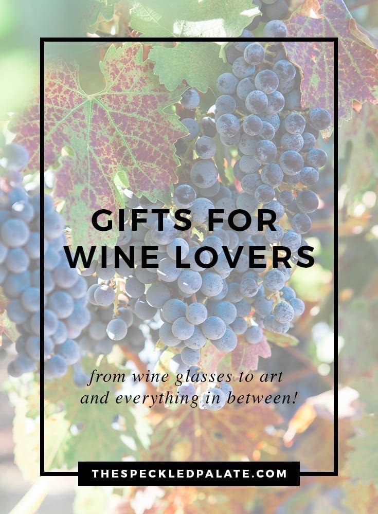 A bunch of wine grapes on a vine with the text 'gifts for wine lovers'