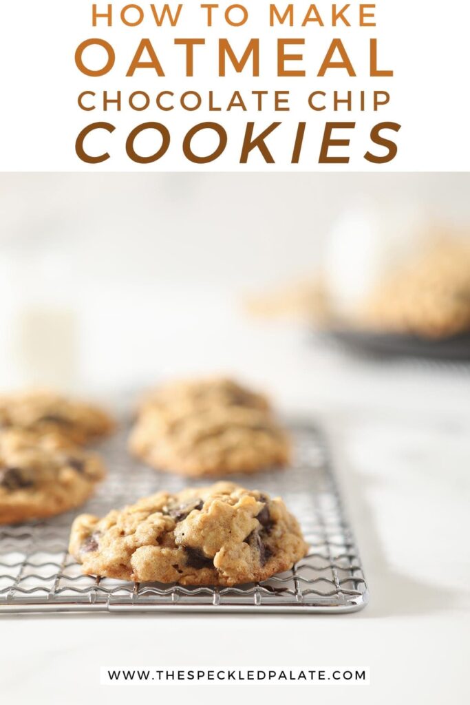 Close up of an oatmeal chocolate chip cookie on a wire cooling rack with other cookies behind it with the text 'how to make oatmeal chocolate chip cookies'