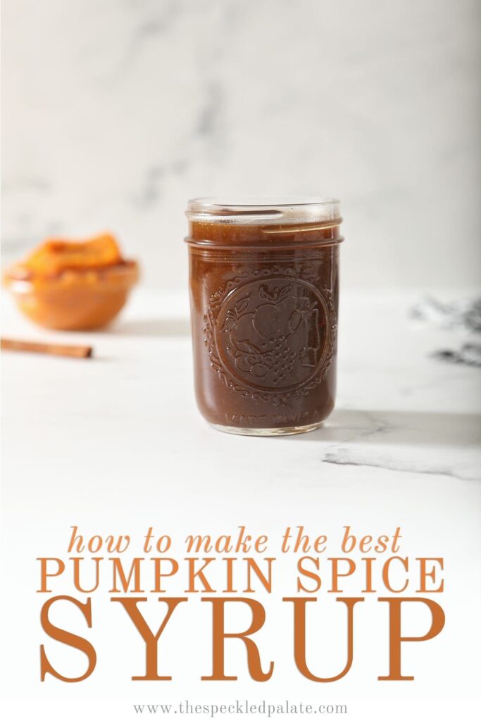 A jar of Pumpkin Spice Syrup sits on marble with a cinnamon stick and pumpkin puree behind it with the text 'how to make the best pumpkin spice syrup'