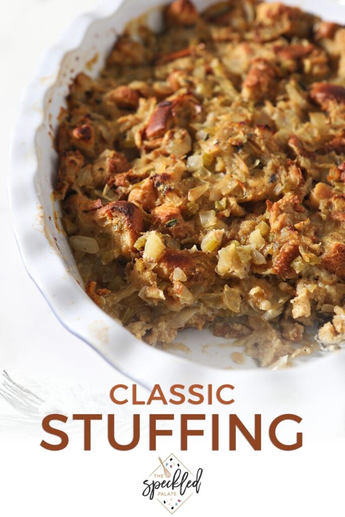 Close up of a casserole dish holding a classic bread stuffing recipe with a scoop taken out of it with the text 'classic stuffing'