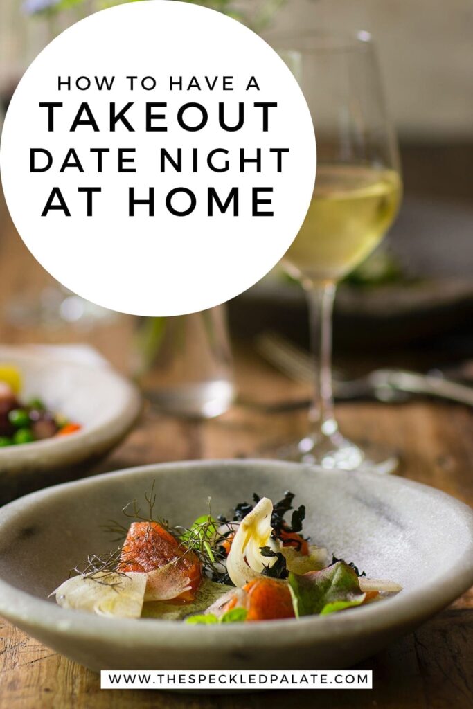 Close up of a bowl holding an intricate dish and a glass of white wine with the text 'how to have a takeout date night at home'