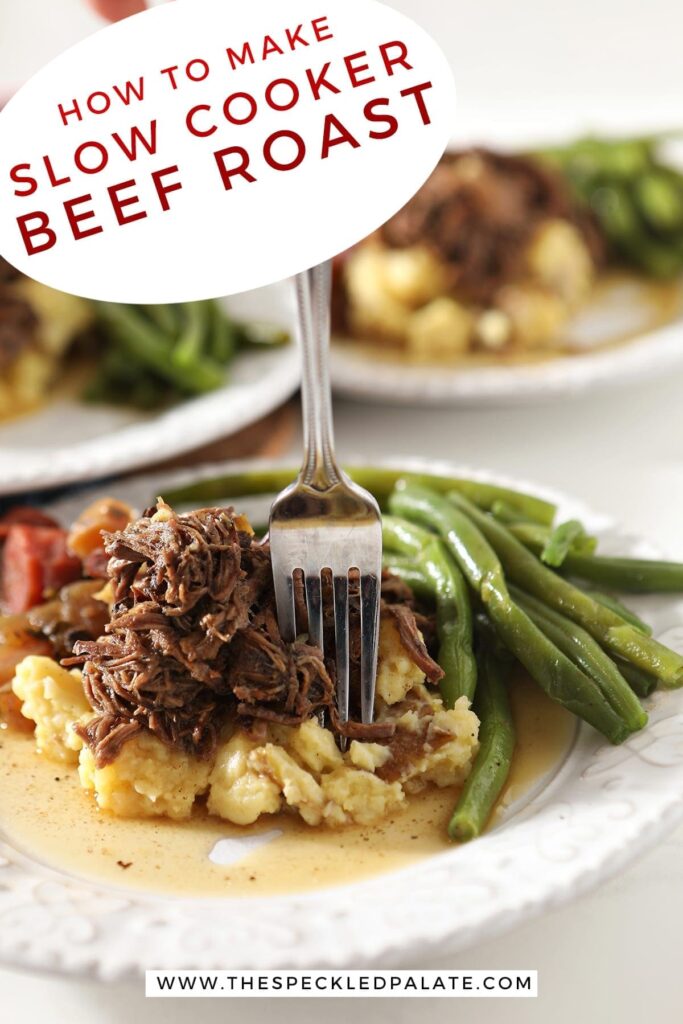 Close up of a fork sticking shredded slow cooker pot roast on top of mashed potatoes and next to steamed green beans with the text 'how to make slow cooker beef roast'