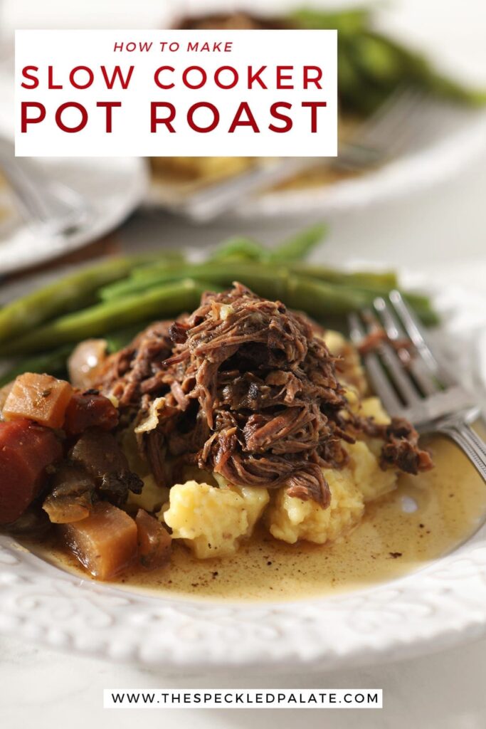 Close up of a plate holding shredded slow cooker pot roast with mashed potatoes, steamed green beans and slow cooked veggies with the text 'how to make slow cooker pot roast'