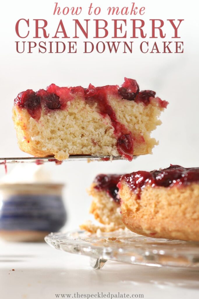 A slice of cake with a cranberry sauce topping is lifted from a cake plate with the text 'how to make cranberry upside down cake'