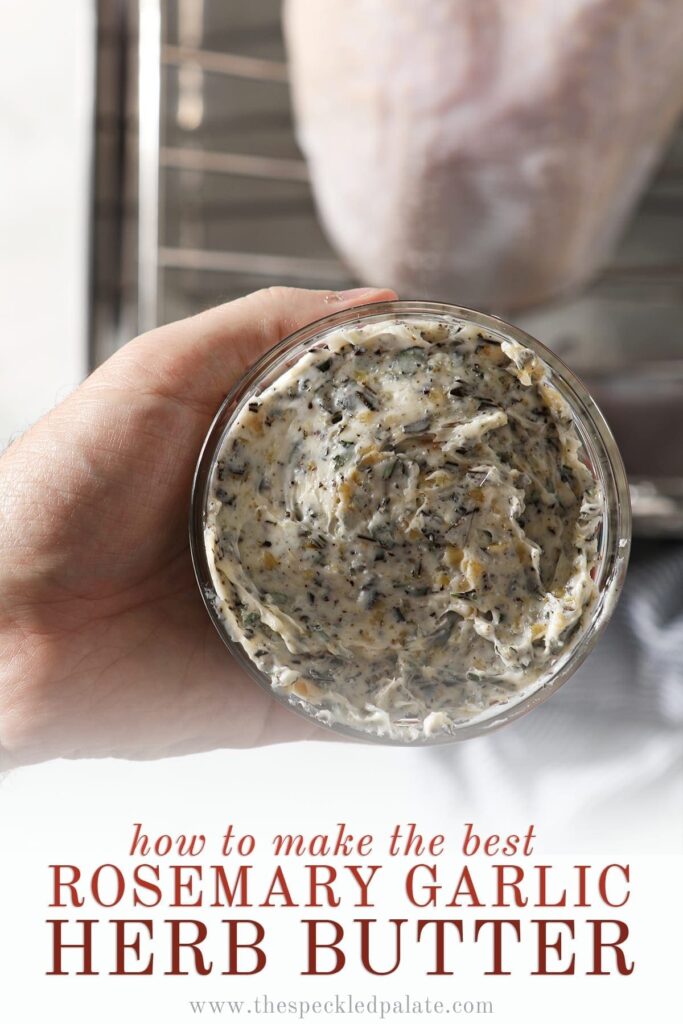 A hand holds a small glass bowl of compound butter above a raw turkey breast in a roasting pan with the text 'how to make the best rosemary garlic herb butter'