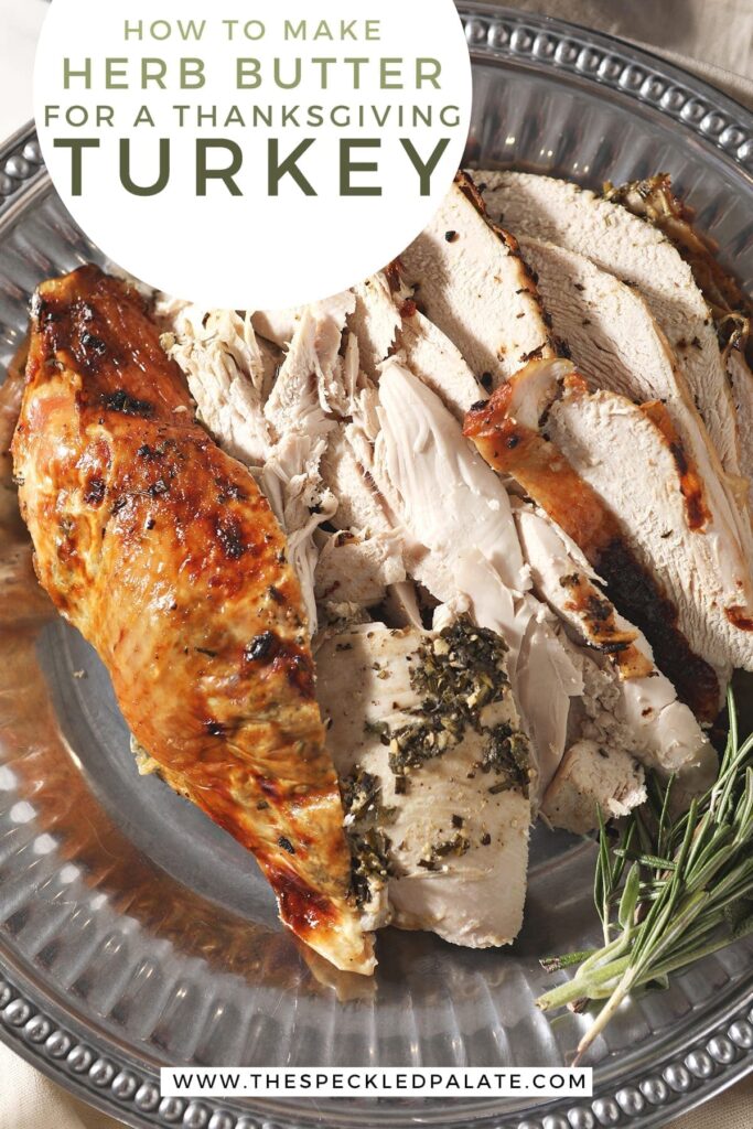 Close up of roasted turkey breast with herb butter on a silver platter with the text 'how to make herb butter for a thanksgiving turkey'