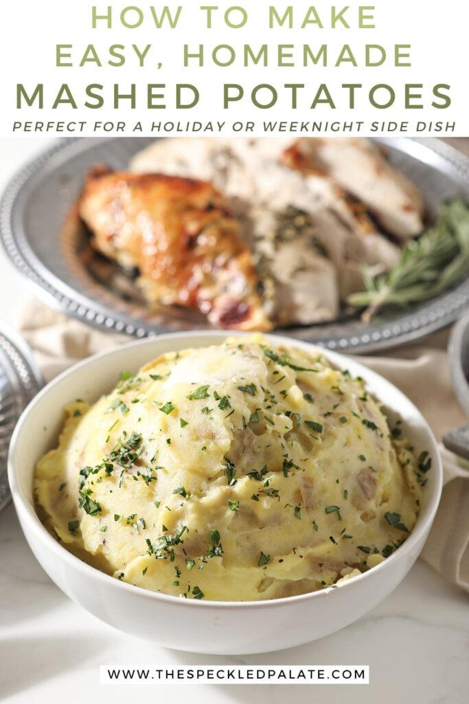 A bowl of mashed potatoes sits in front of a silver platter holding turkey, surrounded by other holiday dishes with the text 'how to make easy, homemade mashed potatoes. perfect for a holiday or weeknight side dish!'