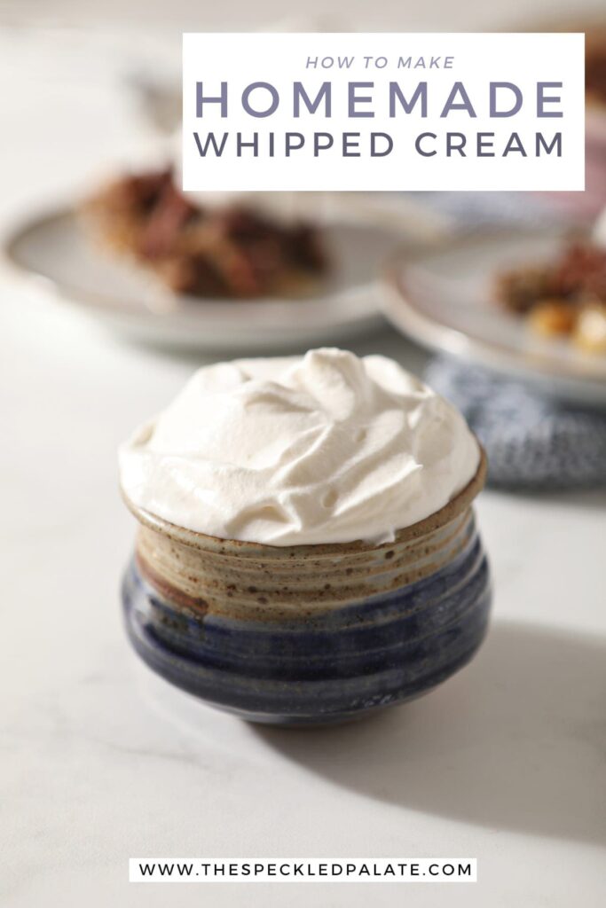 Close up of a blue pottery bowl holding a serving of homemade sweetened whipped cream with the text 'how to make homemade whipped cream'