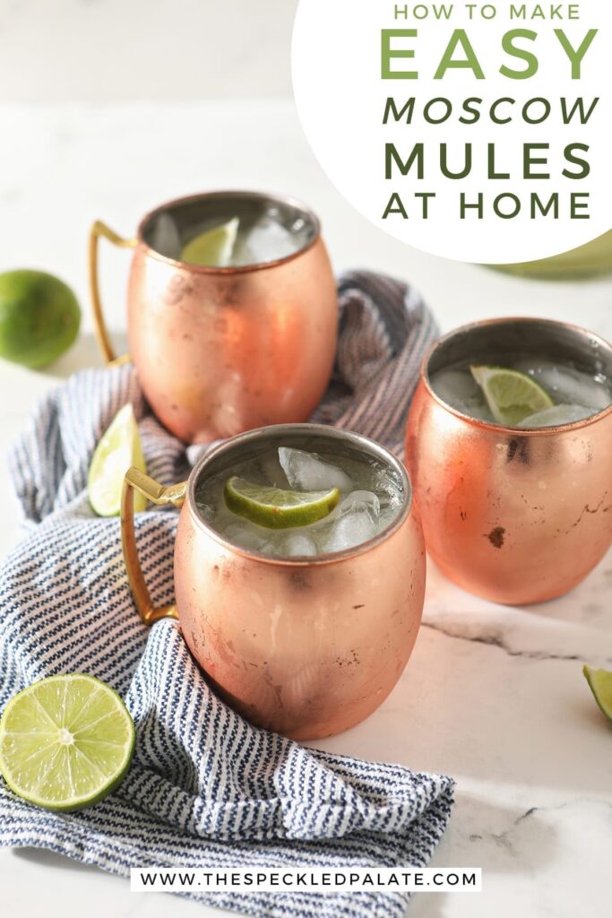 Three Mules in copper mugs sit on a marble surface next to a blue and white striped towel and lime wedges with the text 'how to make easy moscow mules at home'