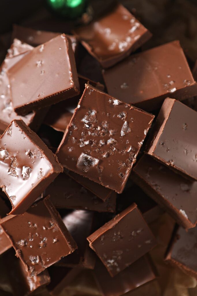 Close up of sliced microwave fudge in a decorative tin