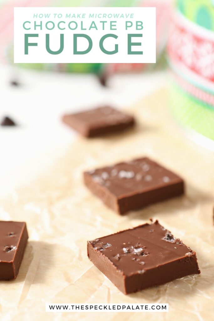 Sliced microwave fudge on parchment with a red and green patterned tin behind it with the text 'how to make microwave chocolate pb fudge'