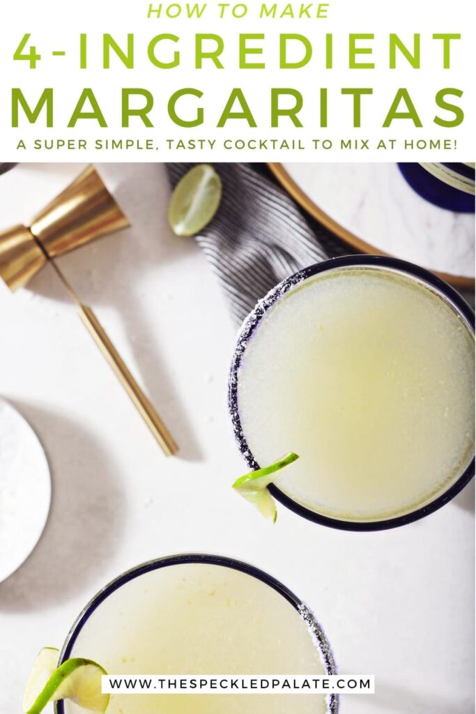 Three Cointreau margaritas sit on a marble counter next to a jigger, lime wedges and a container of salt with the text 'how to make 4-ingredient margaritas. a super simple, tasty cocktail to make at home!'