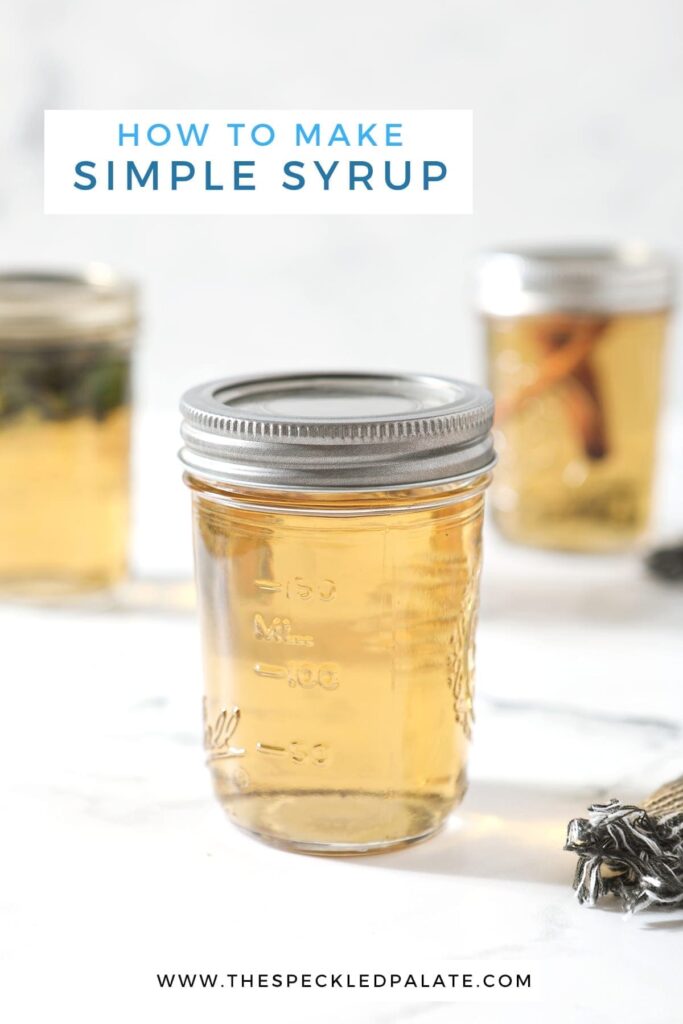 A mason jar holding regular simple syrup sits on front of two other jars holding mint simple syrup and cinnamon simple syrup on a marble surface with the text 'how to make simple syrup'