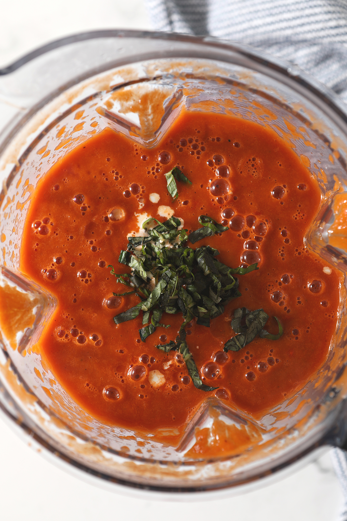 tomato soup ingredients in a blender before blending