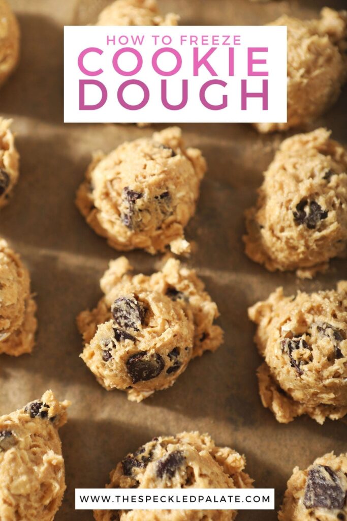 Scooped Oatmeal Chocolate Chip Cookie dough on a baking sheet with the text 'how to freeze cookie dough'