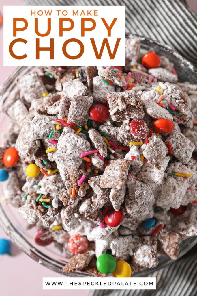 Close up of a bowl with rainbow sprinkles and chocolate-covered candies in Muddy Buddies with the text 'how to make puppy chow'