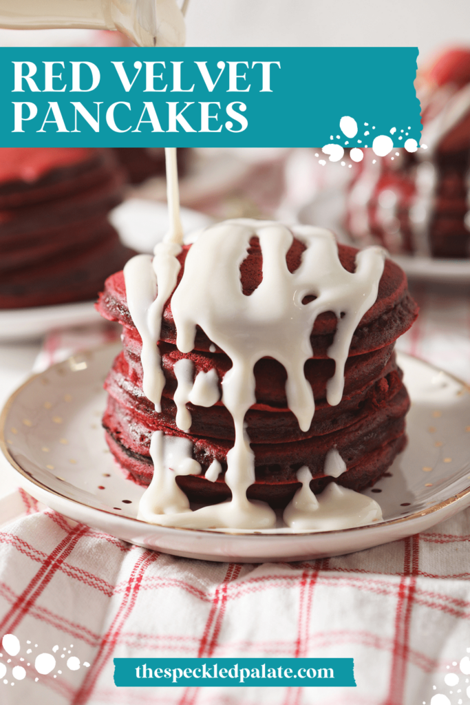 Cream cheese glaze drizzles onto a stack of red pancakes with the text red velvet pancakes