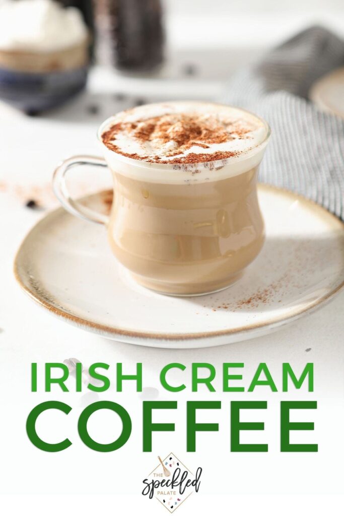 Close up of a clear hot drink mug holding a brown drink with the text 'irish cream coffee'