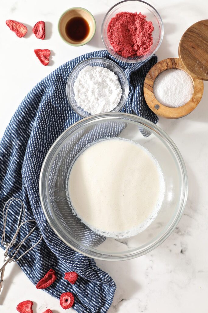 Bowls of ingredients to make homemade whipped cream