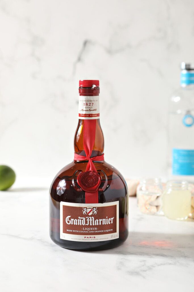 A bottle of Grand Marnier on a marble counter