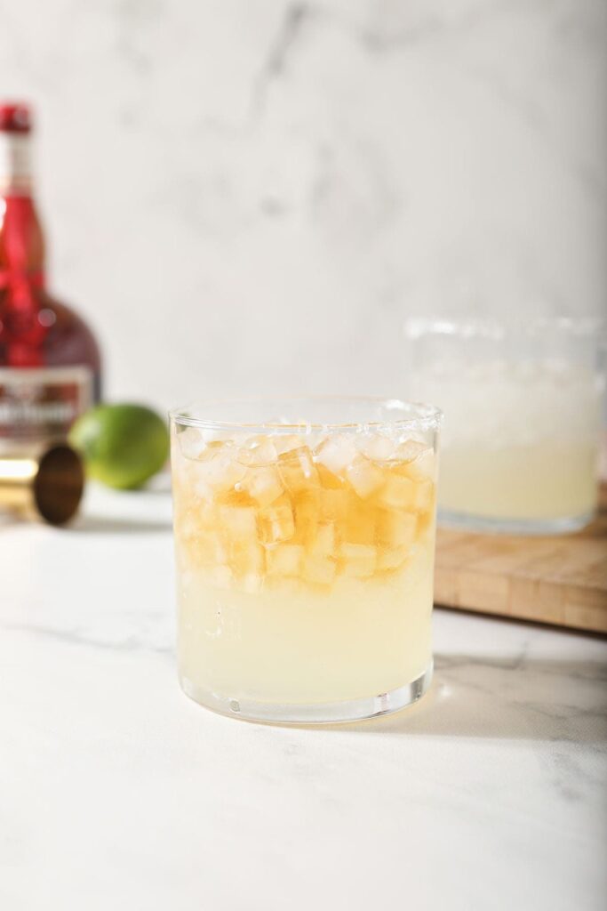 Two Cadillac Margaritas on a marble countertop