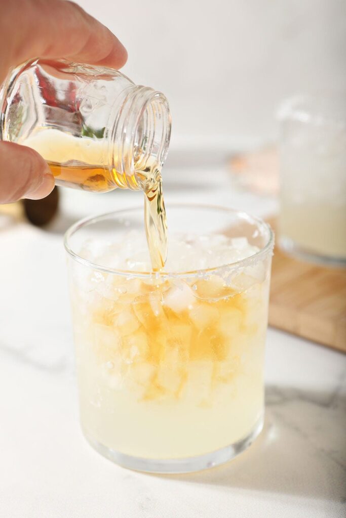 Grand Marnier is poured on top of a Cadillac Margarita