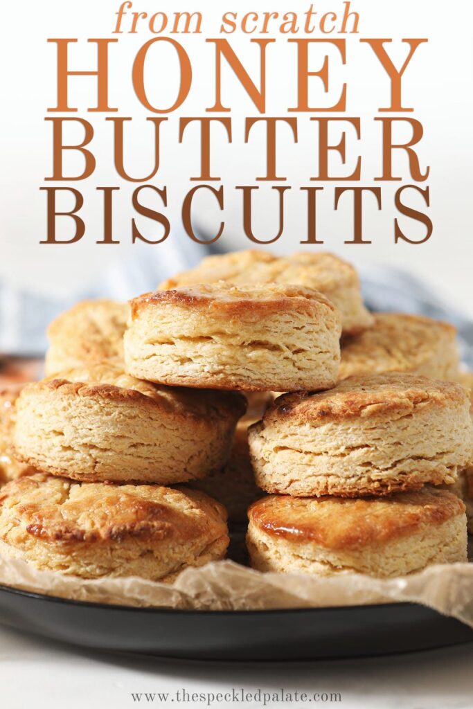 A stack of honey biscuits on a plate with text saying from scratch honey butter biscuits