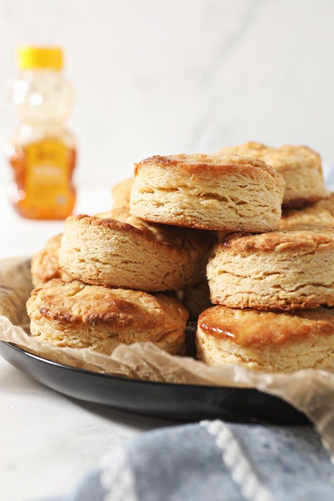 A stack of honey biscuits on a plate