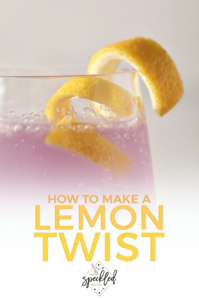 A cocktail twist sits on top of a purple drink with the text 'how to make a lemon twist'