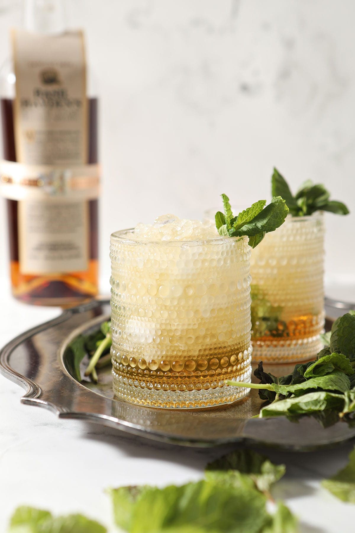 Two mint juleps on a silver tray