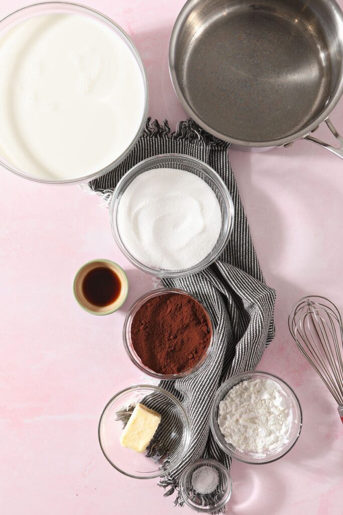 Homemade chocolate pudding ingredients in bowls before mixing