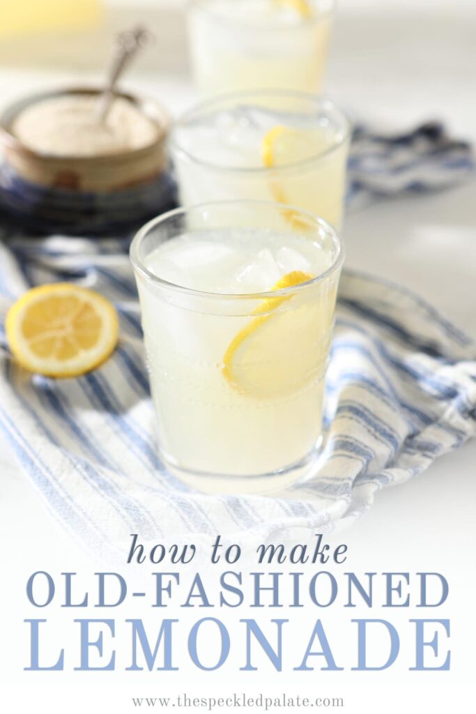 Three glasses of classic lemonade on a blue and white striped towel with Pinterest text