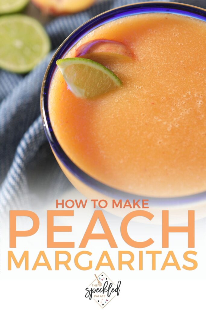 A peach margarita in a blue-rimmed glass with lime and peach wedges with text how to make peach margaritas